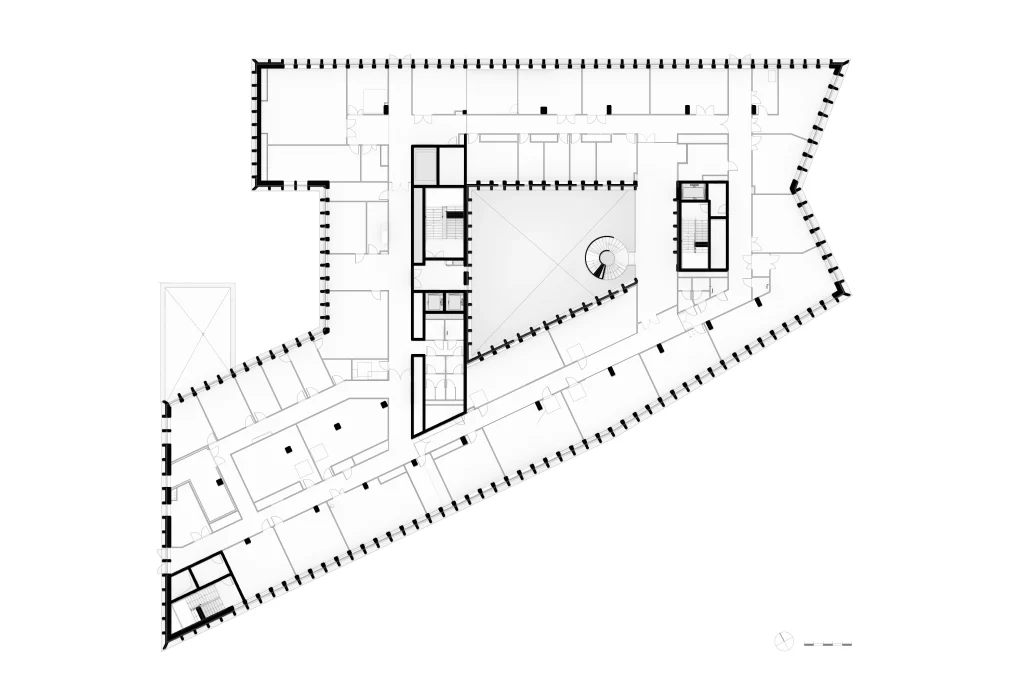Lower-level plan of HTSH showing the central void, circulation cores and perimeter rooms.
